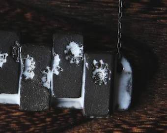 Pieces of the Tide / Black Ceramic Necklace with Seashell Iprints