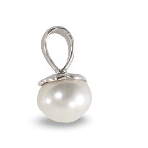 May include: A white pearl pendant featuring a smooth, rounded surface set into a polished silver-toned metal cap. The pendant includes a silver-toned metal bail at the top, designed for attachment to a necklace chain or cord.