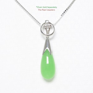 May include: A silver pendant necklace featuring a pear-shaped, light green gemstone. The pendant is suspended from a delicate silver chain. The gemstone is encased in a silver setting. The text "Chain Sold Separately" and "The Pearl Jewelers" is visible.