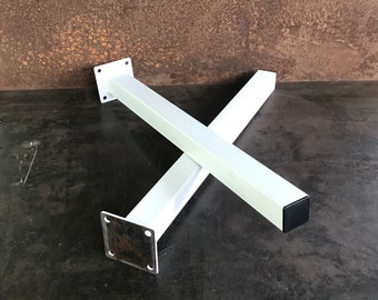 May include: Two white metal table legs with square bases and black plastic feet.