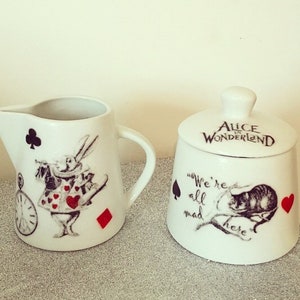 Alice in wonderland white rabbit and Cheshire Cat milk jug and sugar bowl set