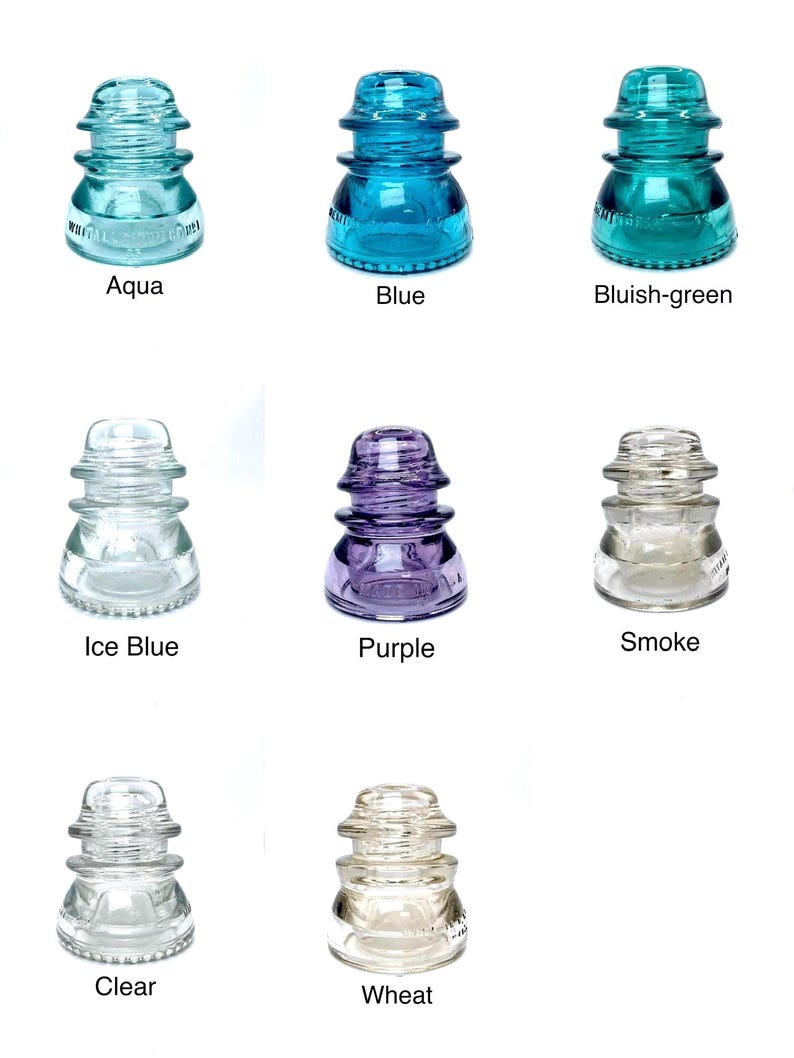 May include: A collection of eight glass electrical insulators arranged in a grid, featuring various colors including aqua, blue, bluish-green, ice blue, purple, smoke, clear, and wheat, each with embossed text and a tiered, rounded shape.