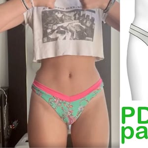 May include: A green and pink patterned underwear with a V-shaped front. A sewing machine is visible in the background. The image also includes a PDF pattern for the underwear.