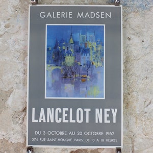 May include: A poster for a Galerie Madsen exhibition of Lancelot Ney's artwork. The painting shows a city scene in blues, yellows, and greens. The poster includes the exhibition dates and location in Paris, France.