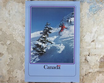 1990s Canada Ski Poster, sking holiday on snowy mountain in blue and white, tourism vacation wall art decor