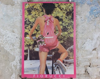 1980 Fiorucci rare Poster, girl with pink cutoff pants and backpack on a bike, Italian fashion label, advertising retro wall art decor