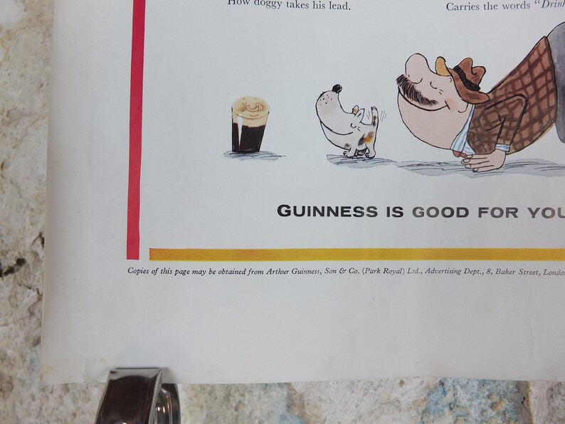 May include: A vintage Guinness advert with a cartoon illustration. The image shows a pint of Guinness, a dog, and a man in a suit. The text "GUINNESS IS GOOD FOR YOU" is displayed. The advert is on a white background.