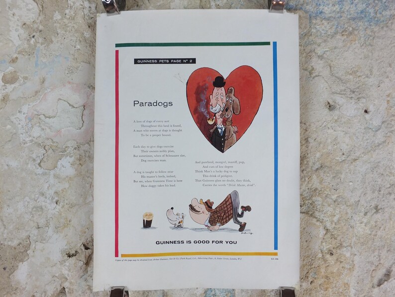 May include: A vintage print from Guinness Pets Page No. 2, showcasing a cartoon illustration. The design features a heart shape with a man and dog, and the title "Paradogs." The text "Guinness is Good for You" is at the bottom of the print.