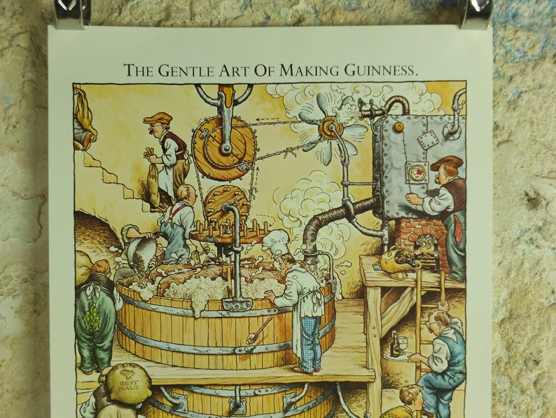 May include: An illustrated print titled "The Gentle Art of Making Guinness." The image depicts a brewery scene with workers, wooden vats, and machinery. The artwork features a warm color palette with detailed illustrations of the brewing process.