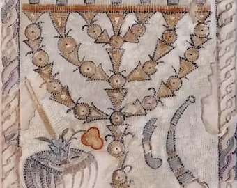 May include: A mosaic depicting a menorah with seven branches, a pineapple, and a bowl. The mosaic is made of small, colorful tiles. The text "DIYIOIAAAФEYKA ACANTABAANETTOIHANE" is written above the menorah.