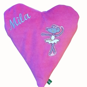 May include: Pink heart-shaped cushion with the name "Mila" embroidered on it. A ballerina mouse with a white tutu is embroidered on the cushion.