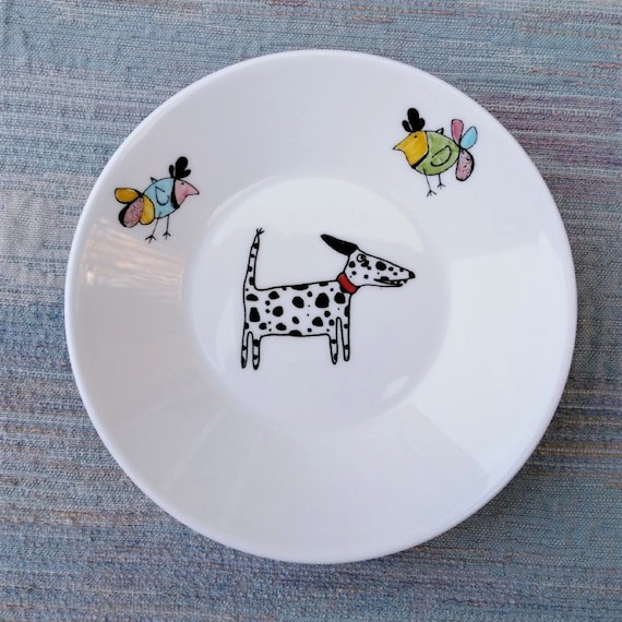 Dalmatian decoration on a shallow dish with two birds.