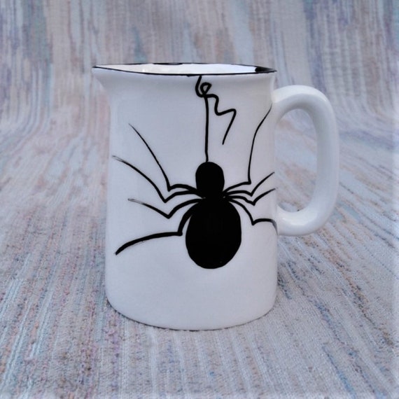 Quarter pint jug with giant spider.