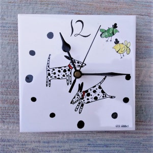 Dalmatian clock. A tile wall clock with spotty dog decoration and a battery quartz movement