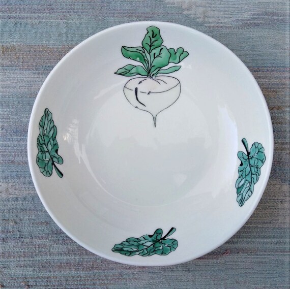 Cereal or soup dish with turnip and spinach.