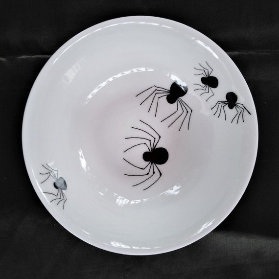 Halloween - A cereal or dessert or pudding dish decorated with crawling spiders. Black on a pure white china dish.