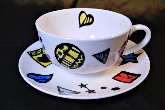 Cup and  saucer decorated with colourful abstract patterns in fine bone china
