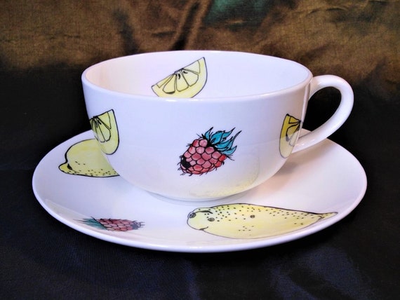 Tea cup and  saucer decorated with lemons and raspberries in fine bone china
