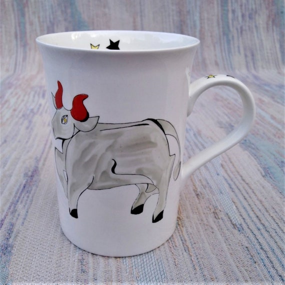 Taurus the Bull painted on a mug.
