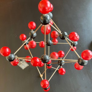 Vintage wood and metal carbon dioxide molecular model