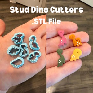 May include: The image displays blue plastic dinosaur-shaped cutters and several small, colourful dinosaur-shaped studs. The studs are pink, orange, green, and yellow. The text "Stud Dino Cutters .STL File" is at the top of the image.