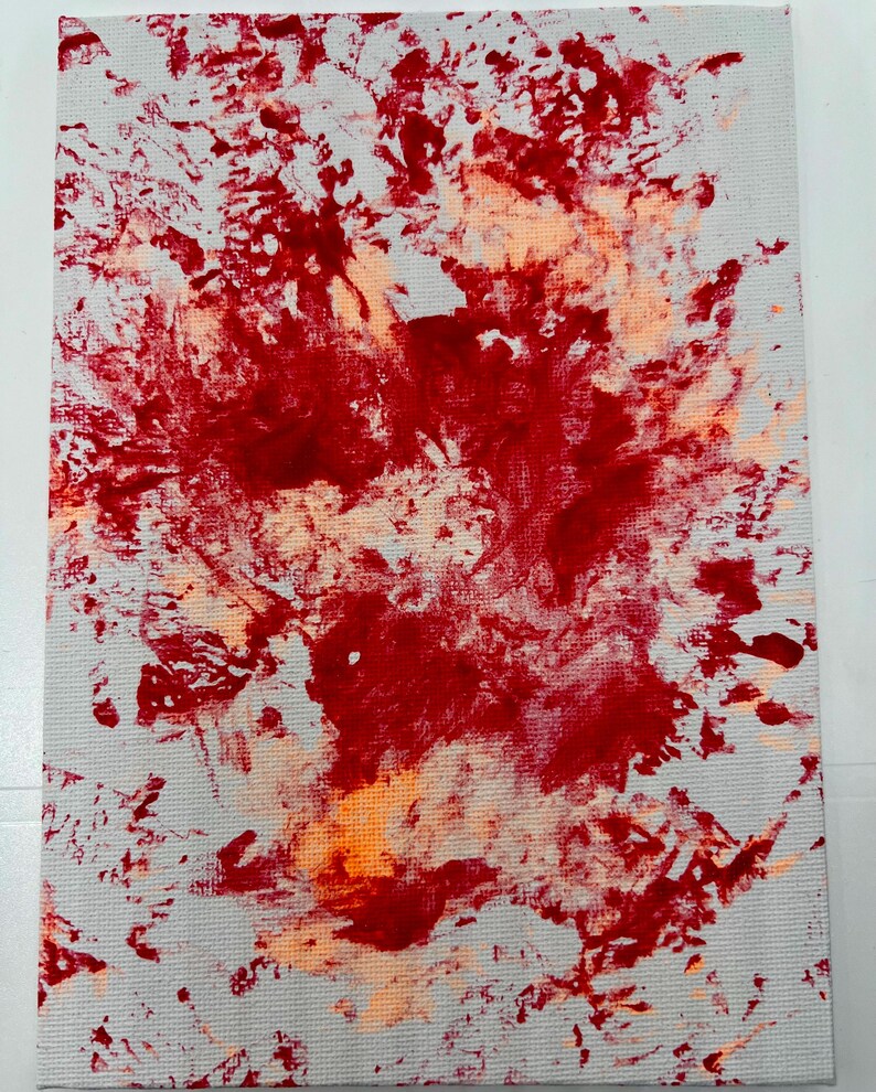 May include: Abstract painting on canvas with red and orange paint splatters on a white background.