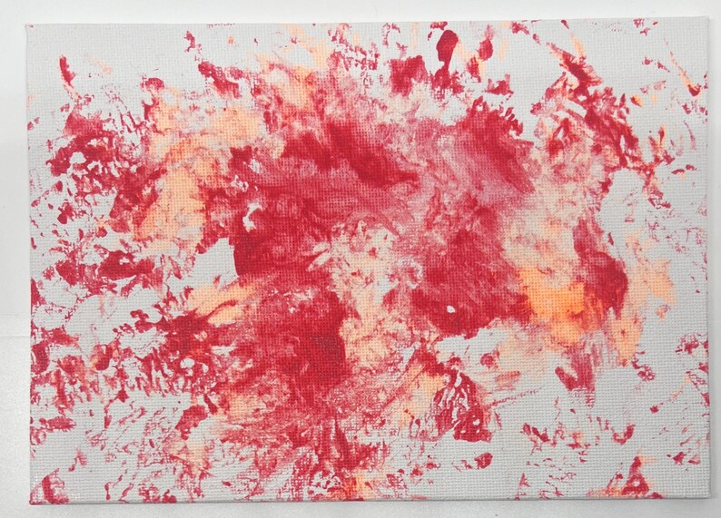 May include: Abstract painting with a red and orange splatter pattern on a white canvas.