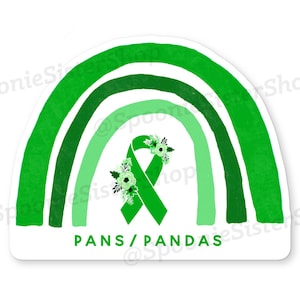 May include: Green rainbow with a green ribbon and white flowers in the center. The text "PANS/ PANDAS" is written below the ribbon.