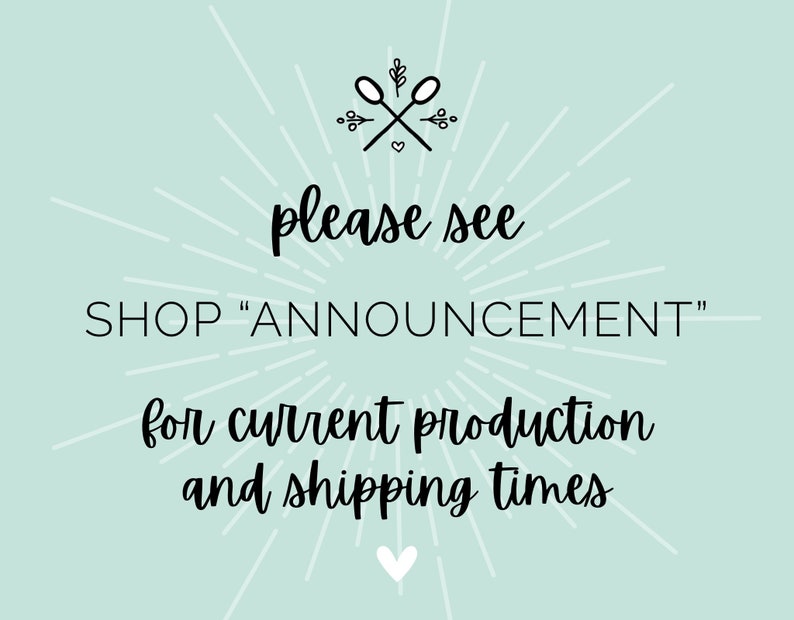 May include: A light blue background with a white starburst design. The text "please see SHOP "ANNOUNCEMENT" for current production and shipping times" is written in black cursive font. A small heart is at the bottom of the image.