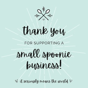 May include: A light blue background with white rays emanating from the center. The text "thank you for supporting a small spoonie business!" is in black cursive font. Below the text is a heart symbol and the text "it seriously means the world" in smaller font.