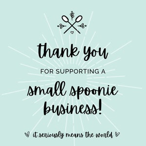 May include: A light blue background with white rays emanating from the center. The text "thank you for supporting a small spoonie business!" is in black cursive font. Below the text is a heart symbol and the text "it seriously means the world" in smaller font.