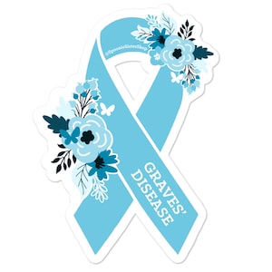 May include: Light blue ribbon with a floral design and the text "GRAVES' DISEASE" on the ribbon. The ribbon is a symbol of awareness for Graves' disease.