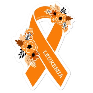 May include: Orange ribbon with a floral design and the word "LEUKEMIA" written on it.