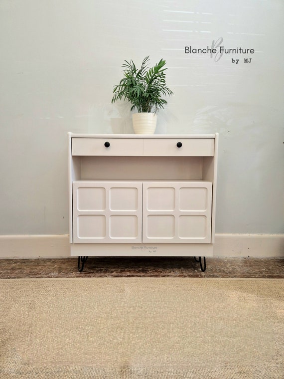 White sideboard sale with black legs