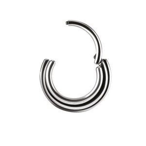 May include: A silver triple hoop ring for body piercing. The ring is made of surgical steel and has a seamless design.