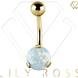 May include: Gold belly button ring with a clear opal gemstone. The ring is made of 14k gold and has a simple design.