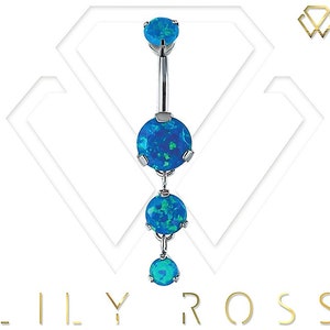 May include: A silver belly button ring with three blue opal stones. The stones are round and have a sparkly finish.