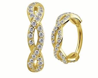 May include: Two gold-colored, infinity-shaped earrings. Each earring is encrusted with small, clear gemstones. One earring is a hoop style, and the other is a dangle style. The earrings are displayed against a white background.
