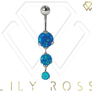 May include: A silver belly button ring with three blue opal stones. The stones are round and have a sparkly finish.