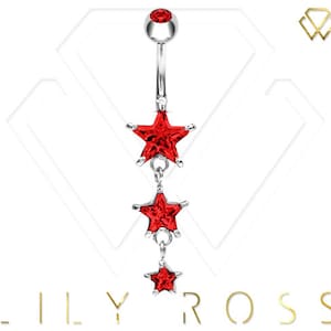 May include: A silver belly button ring with a dangling chain of three red star-shaped crystals.