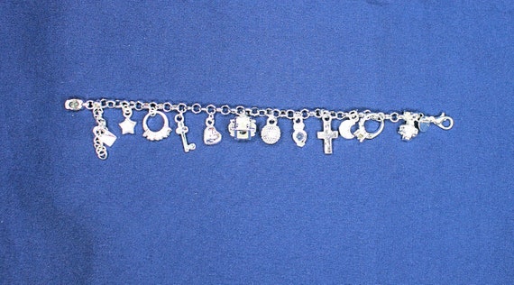 Exquisite .925 Sterling Silver Plated 13 Charm  Bracelet