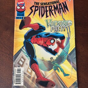 May include: The Sensational Spider-Man comic book, issue 17, featuring Spider-Man in a dynamic pose with the Vulture. The cover art showcases vibrant colors and action-packed illustrations, with the text "Vulture's Prey!" prominently displayed.