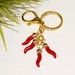 see more listings in the Keychains section