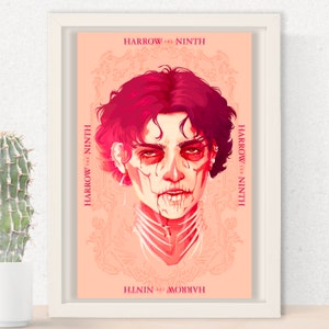 May include: Framed art print featuring a stylized portrait with a skeletal face and red hair. The artwork has the text "HARROW THE NINTH" in a repeating pattern around the central image. The color palette is primarily peach and red.