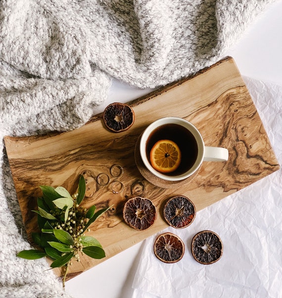 A genuine live-edge slab board where no two are alike — the natural bark and grain make every piece a small piece of furniture for your countertop.