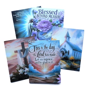 May include: A collection of religious-themed art prints. One print features a cross with lilies, another a church, and others include text like "Blessed Beyond Measure" and "This is the day the Lord has made..."