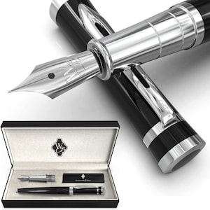 May include: A black and silver fountain pen with a silver nib and a black and silver cap. The pen is in a black box with a silver logo. The box also contains a black and silver rollerball pen.
