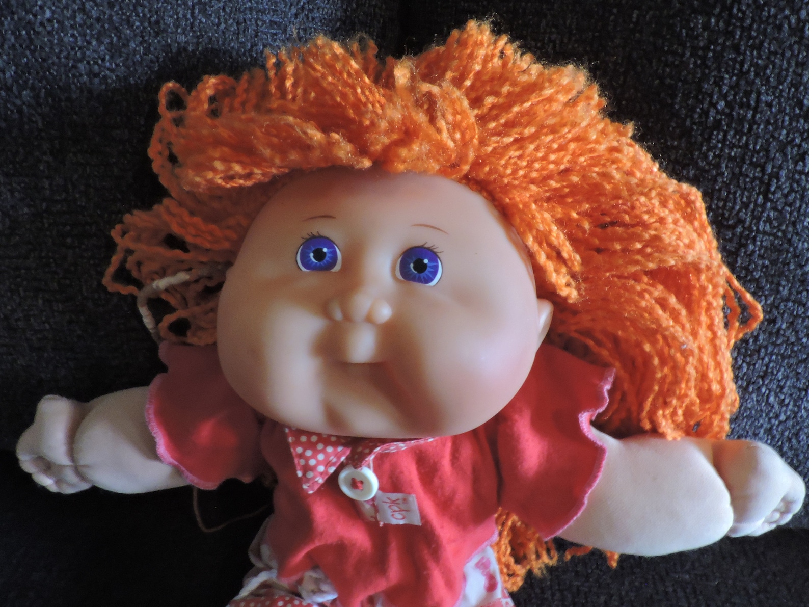 red fuzzy cabbage patch doll