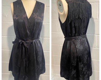 Handmade black floral print wrap dress with fringe detail.