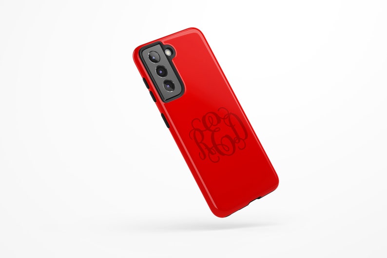 May include: Red phone case with a black camera bump and a monogrammed design that says "RED".
